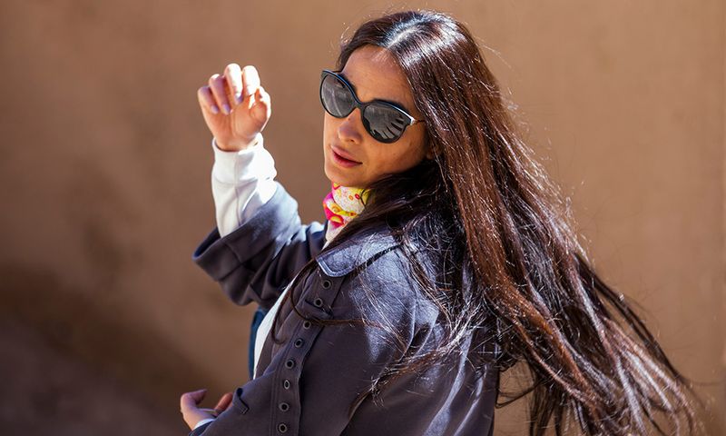 woman with long hair looking back