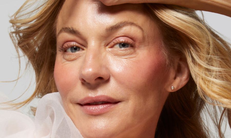 blonde woman wearing laura geller blush