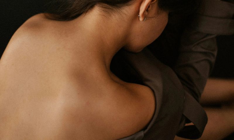 woamn's bare back and shoulders