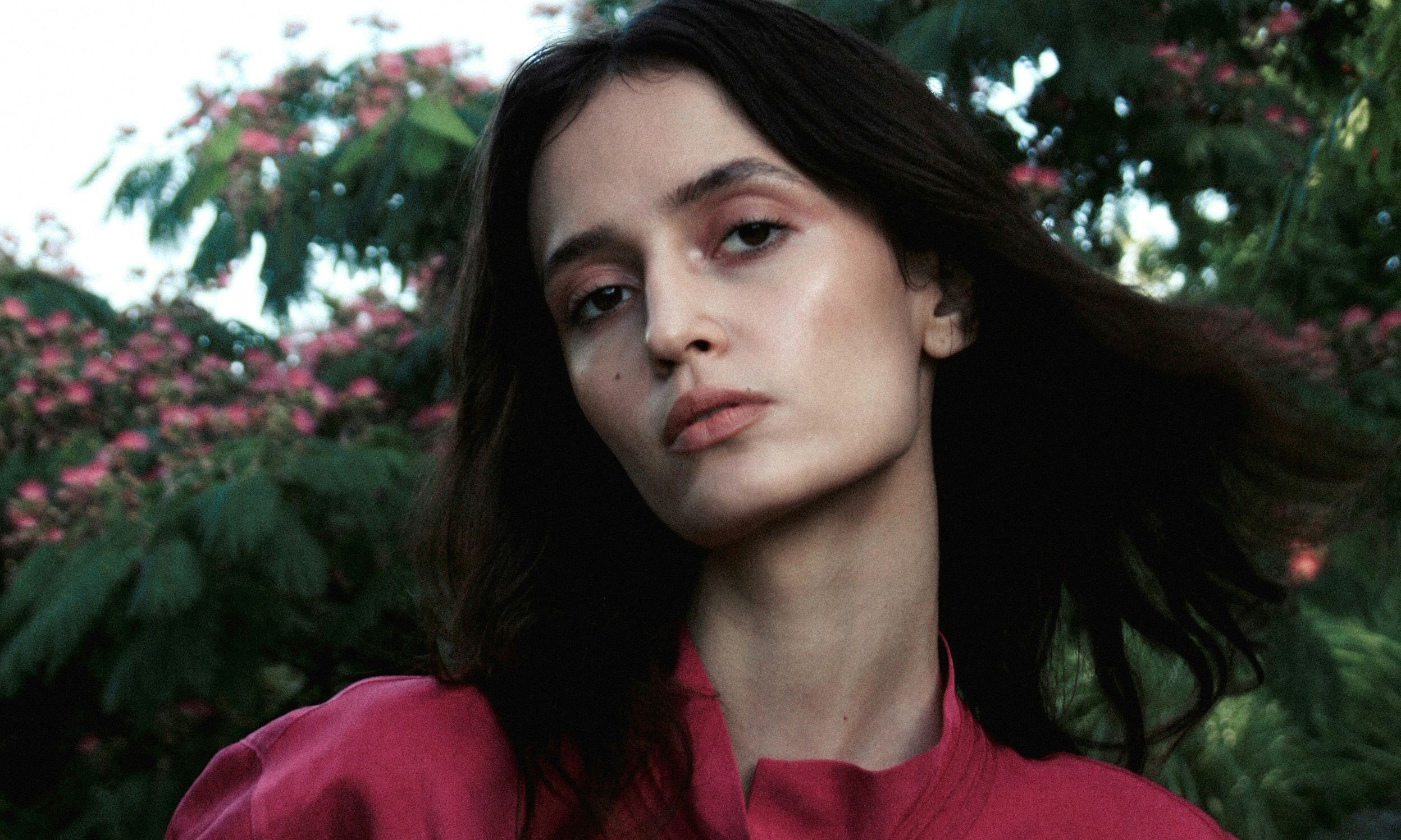 portrait of woman in pink blouse