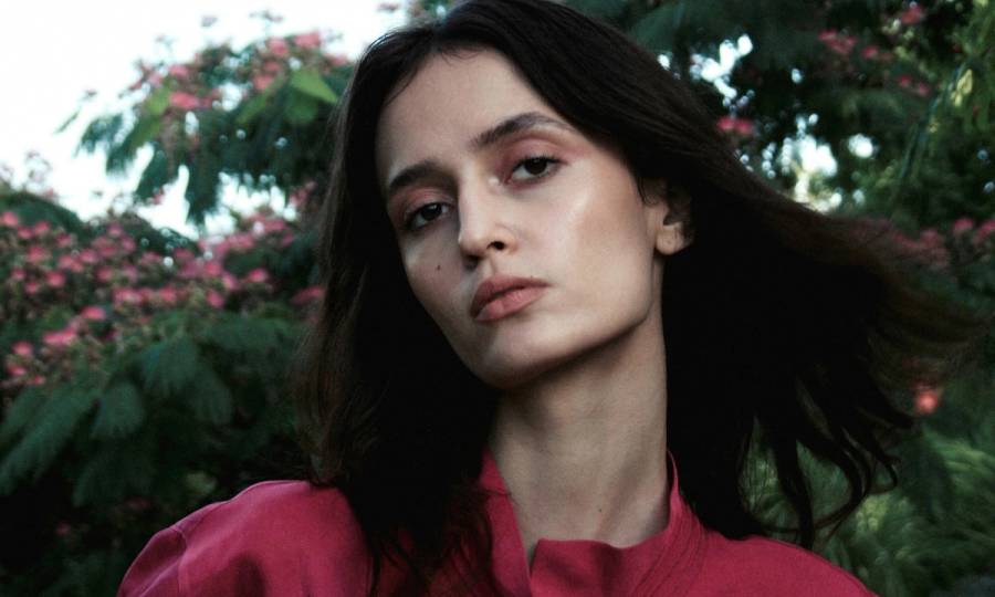 portrait of woman in pink blouse