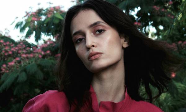 portrait of woman in pink blouse