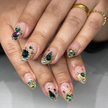 Close-up of nails with gemstones