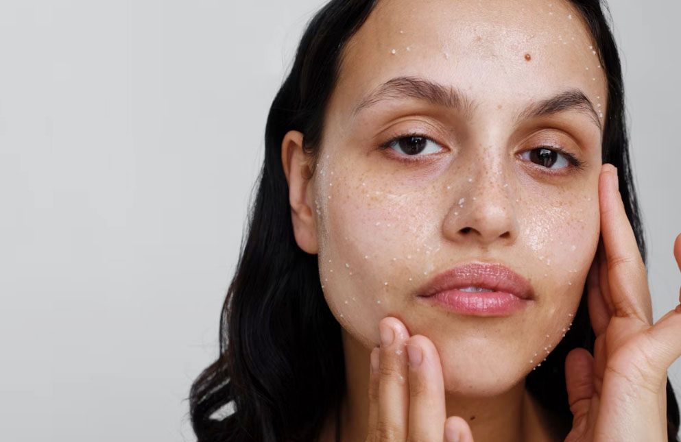 woman washing face with Verso Skincare Cleansing Balm