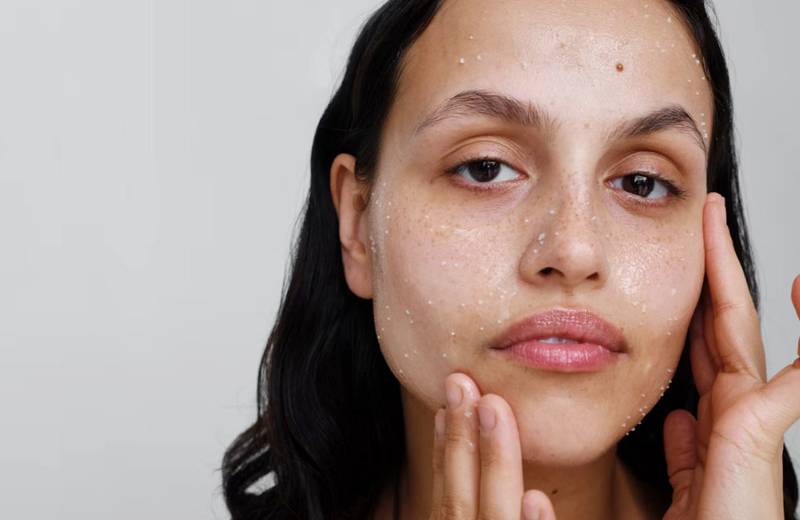 woman washing face with Verso Skincare Cleansing Balm
