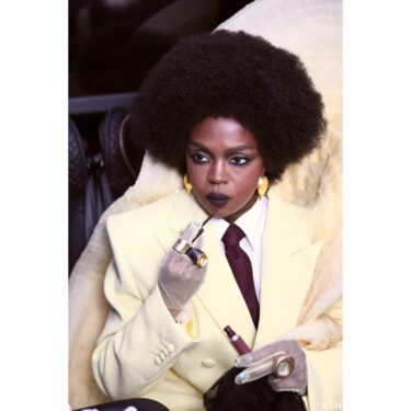 Lauryn Hill applying MAC lipstick at the Met Gala