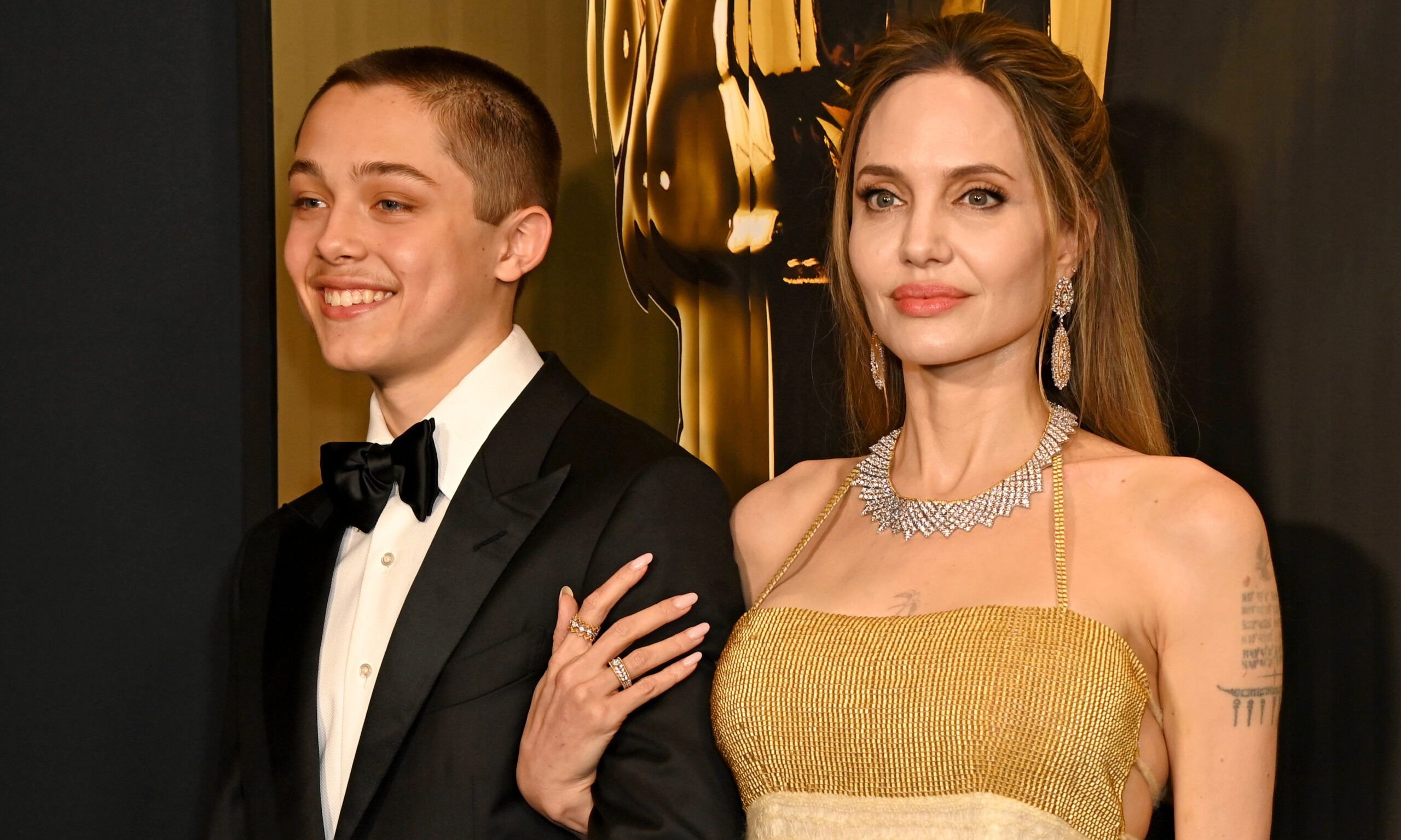 HOLLYWOOD, CALIFORNIA - NOVEMBER 17: (L-R) Knox Jolie-Pitt and Angelina Jolie attend the 2024 Governors Awards at Dolby Theatre on November 17, 2024 in Hollywood, California.
