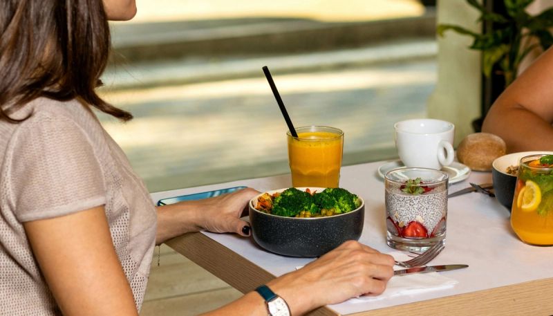 woman at a table eating healthy