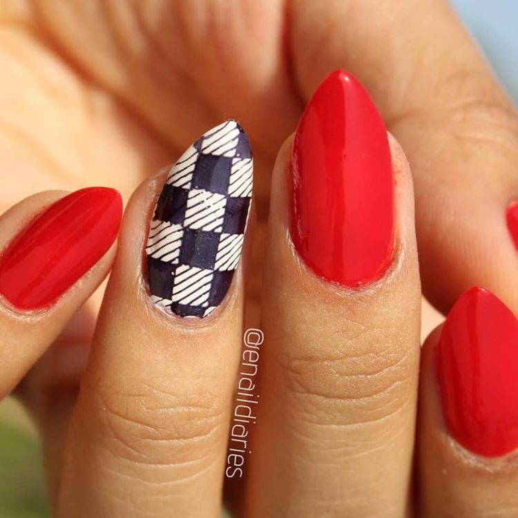 Red nails with a checkerboard accent