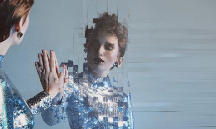 futuristic image of woman looking at reflection