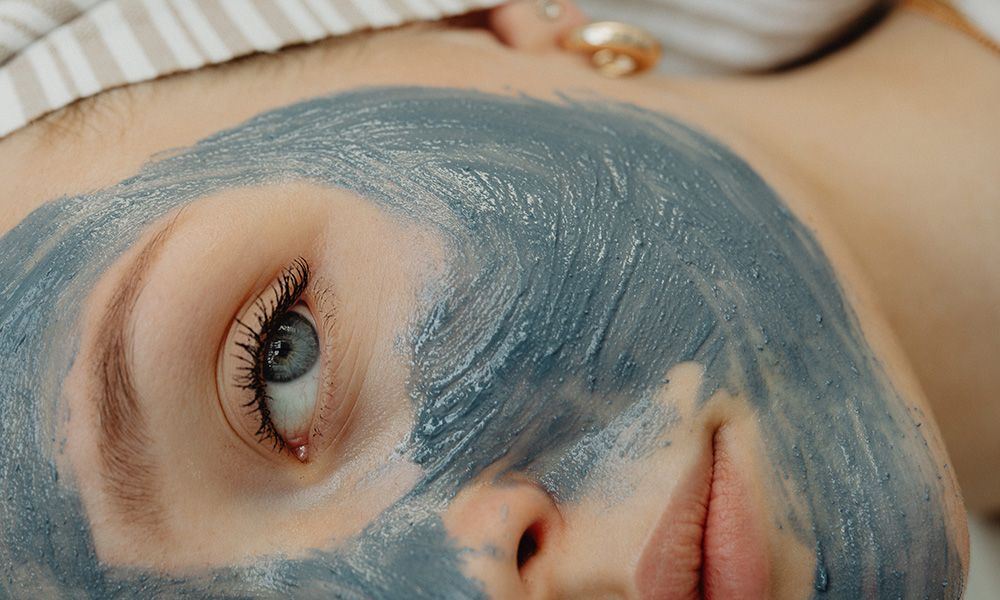 woman with blue face mask