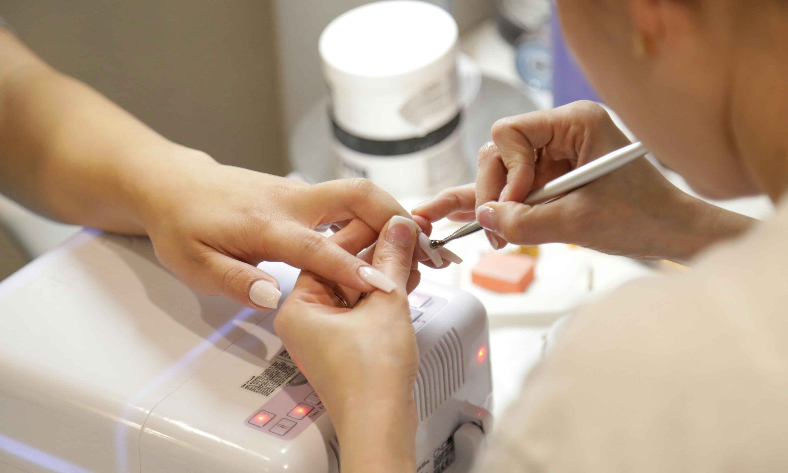 Nail technician giving a gel manicure