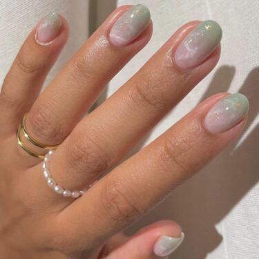 close-up of oval nails with marble design