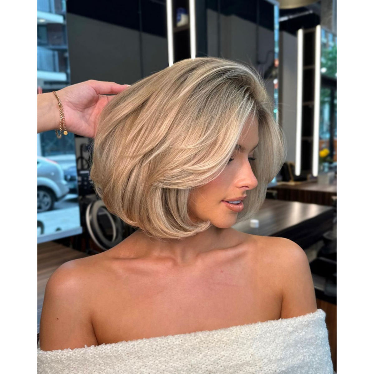A side profile of a woman with old-money blonde bob