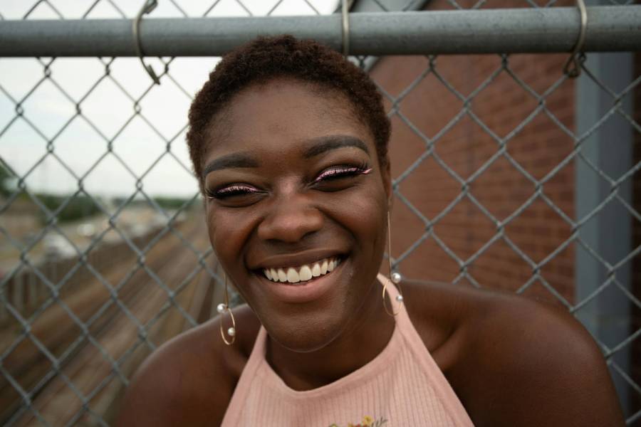 Woman with pink winged eyeliner