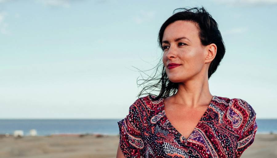 Woman sitting on the beach