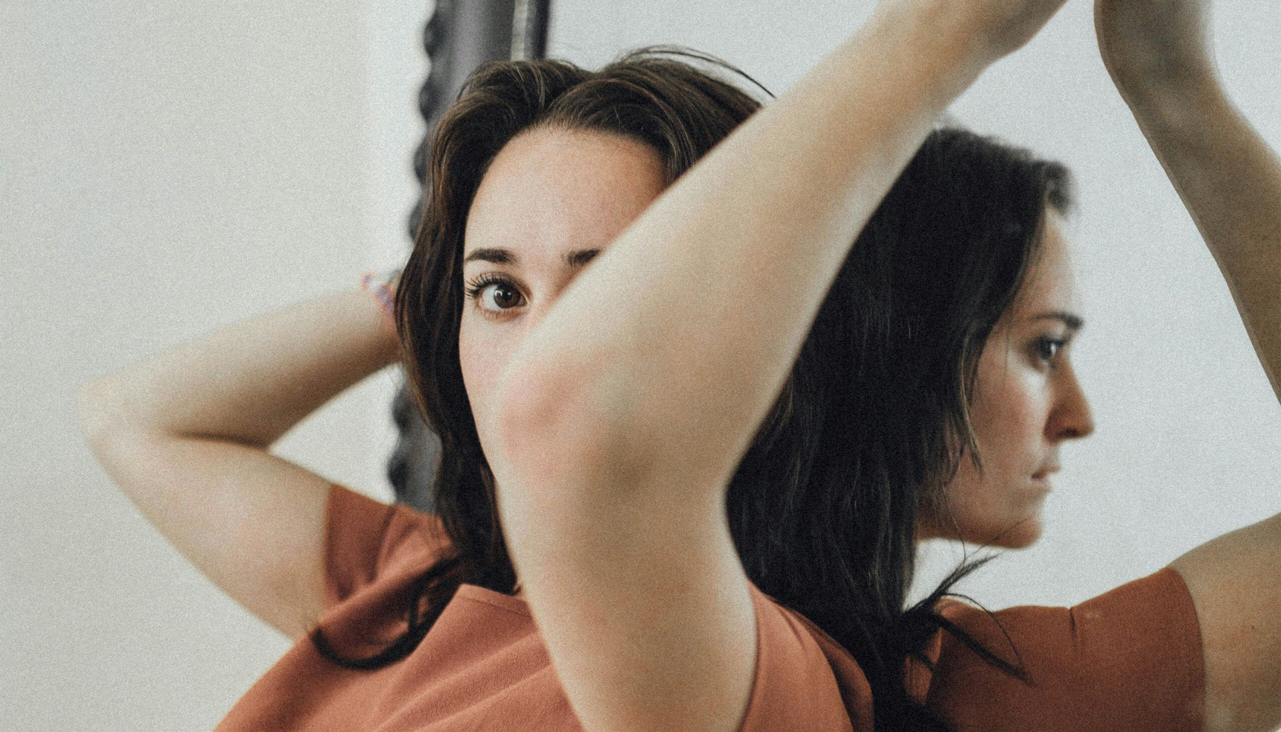 woman posing with a mirror