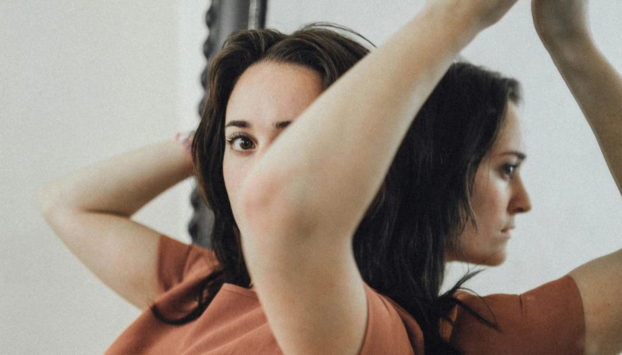 woman posing with a mirror