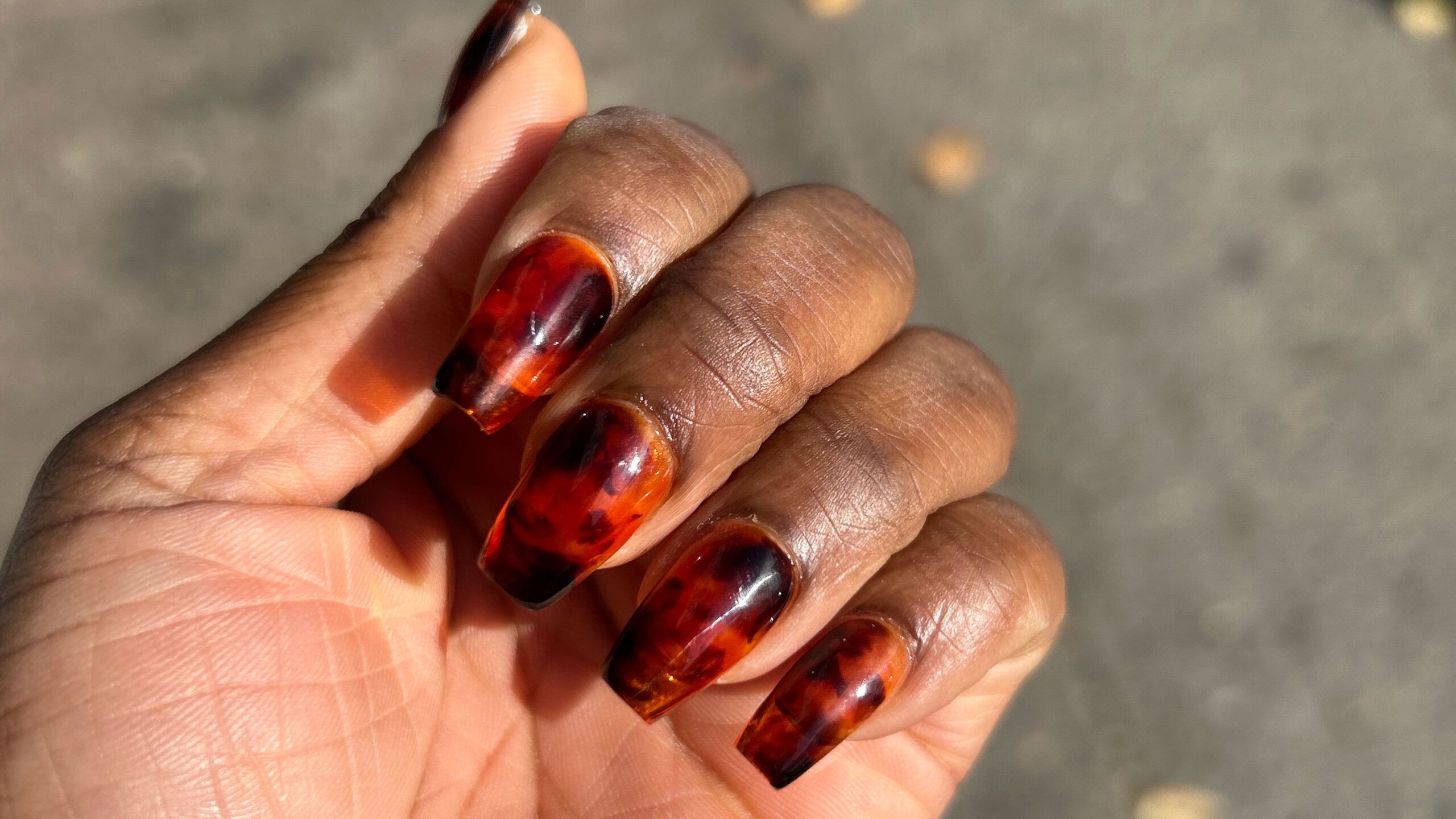 short coffin nails with a tortoise shell print