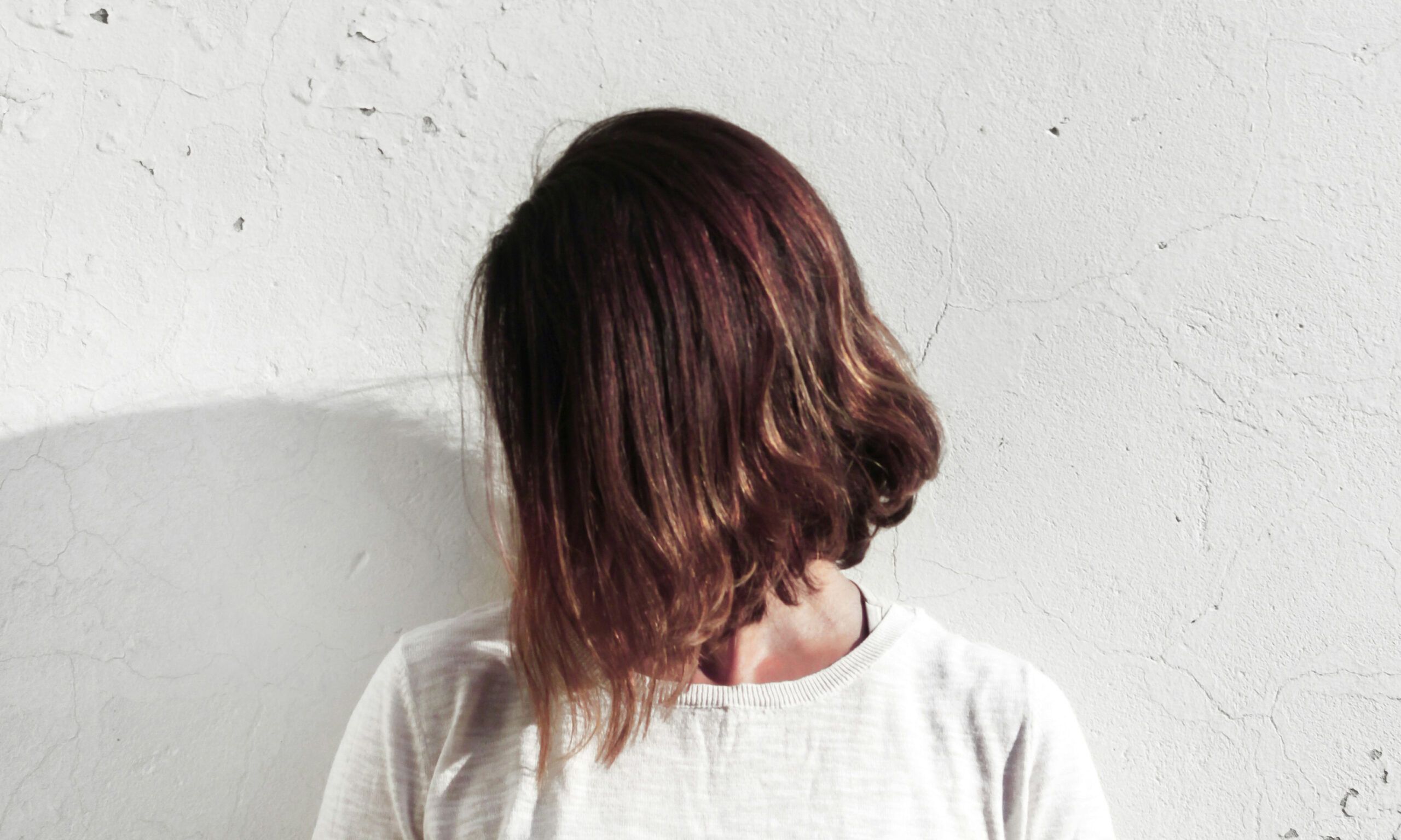Woman with short latte brown hair