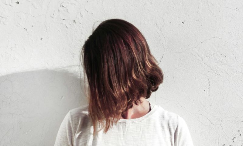 Woman with short latte brown hair