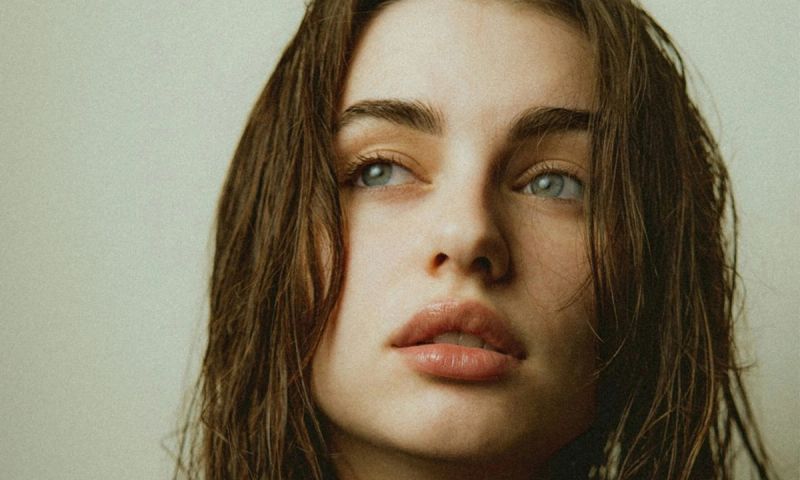 woman with damp hair and clear skin