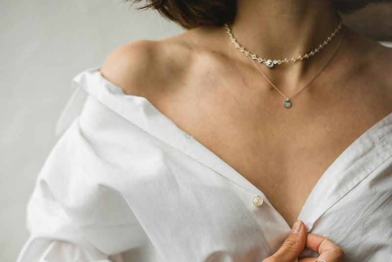 woman in white blouse showing chest