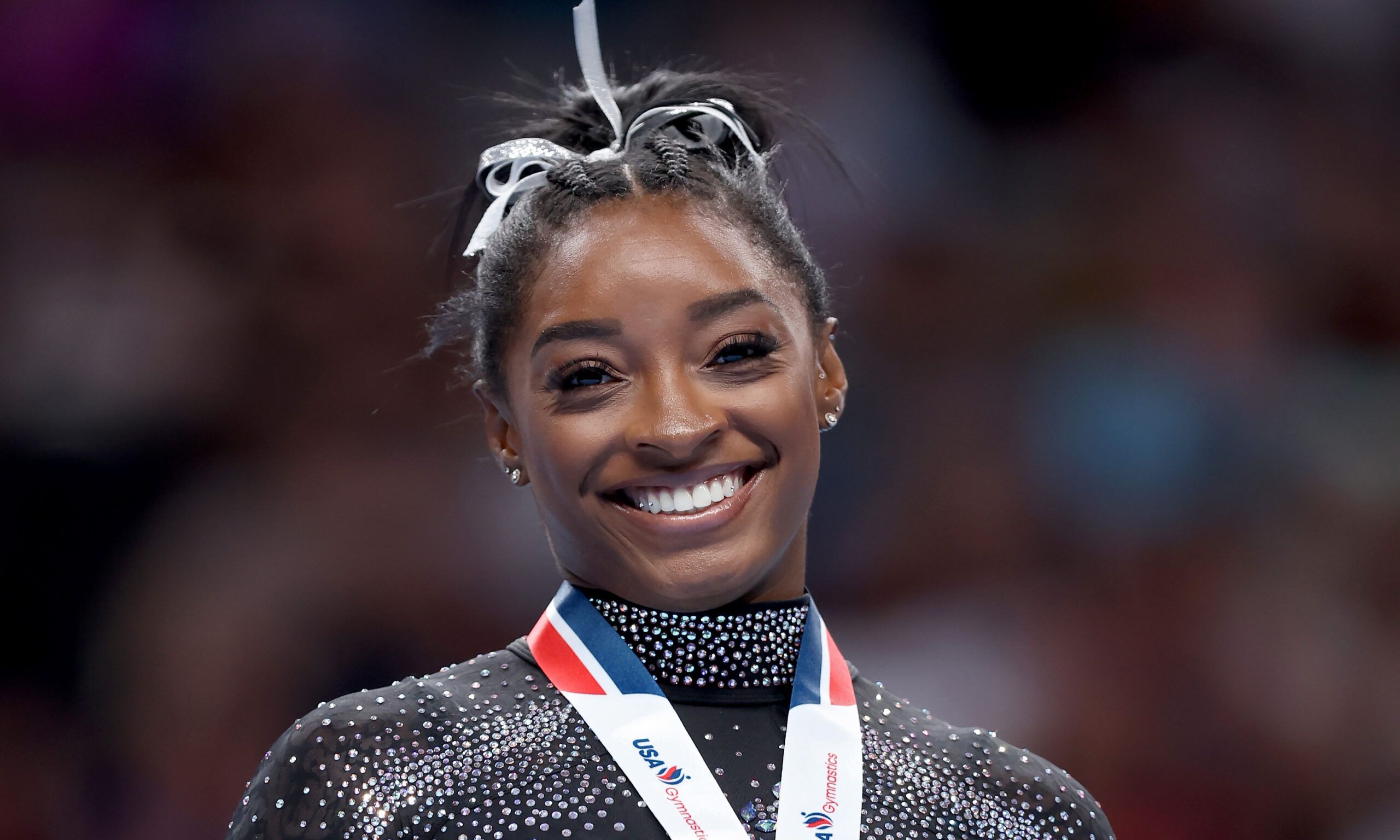 Simone Biles celebrates after placing first in the floor exercise competition on day four of the 2023 U.S. Gymnastics.