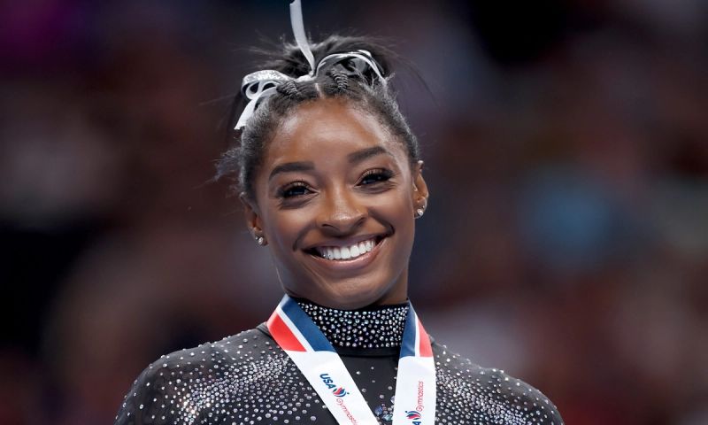 Simone Biles celebrates after placing first in the floor exercise competition on day four of the 2023 U.S. Gymnastics.
