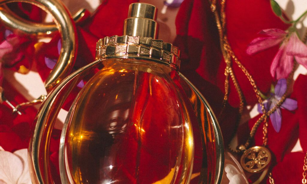 perfume bottle rose petal background