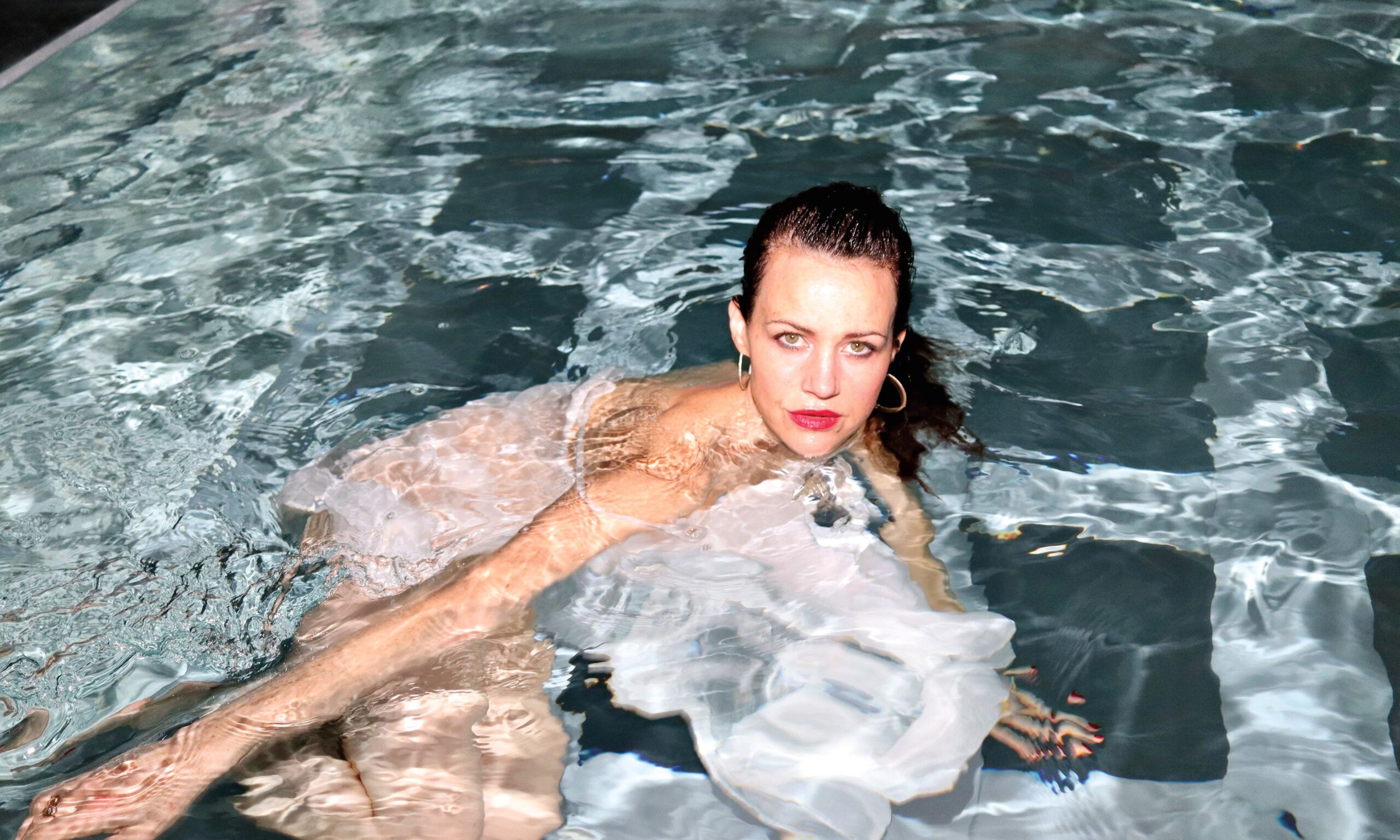 Carla Gugino in a pool