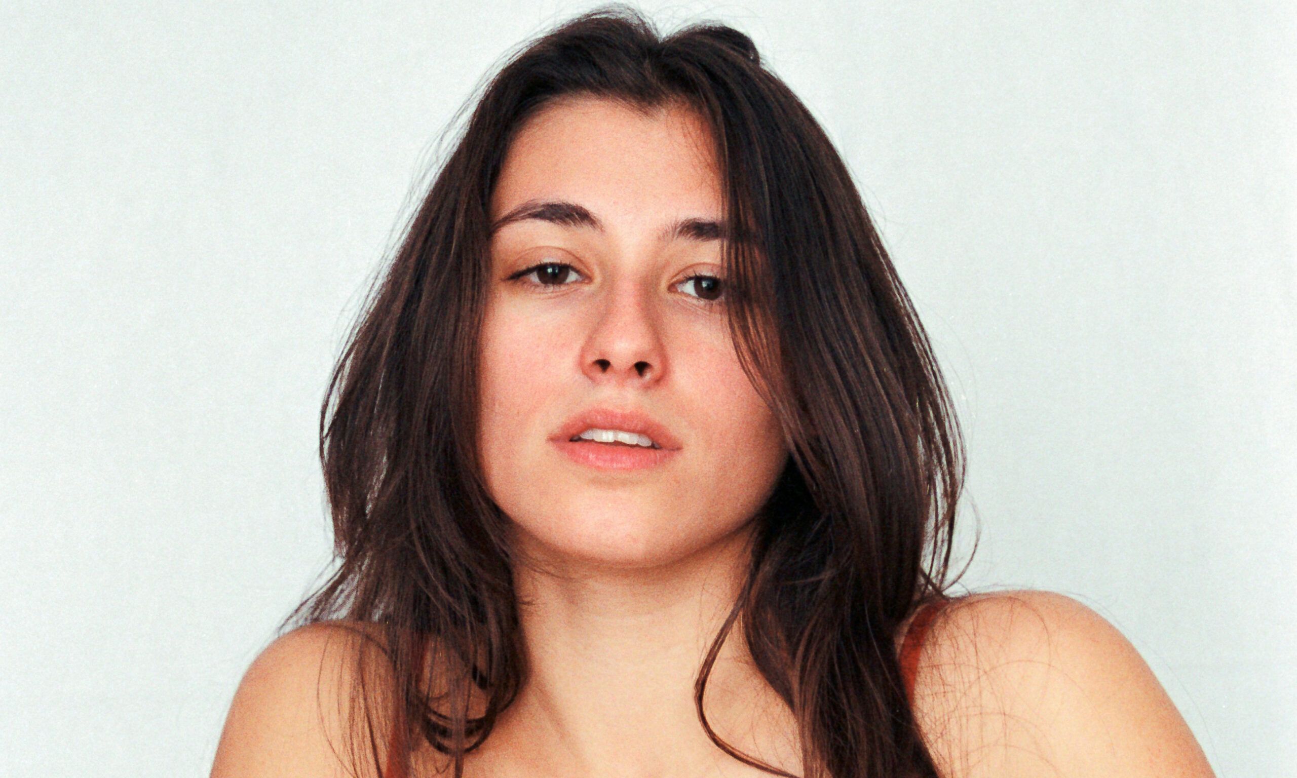 brown haired woman with bare face
