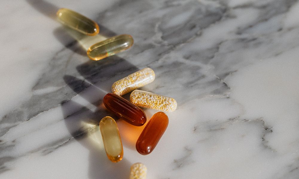 supplement pills on marble table