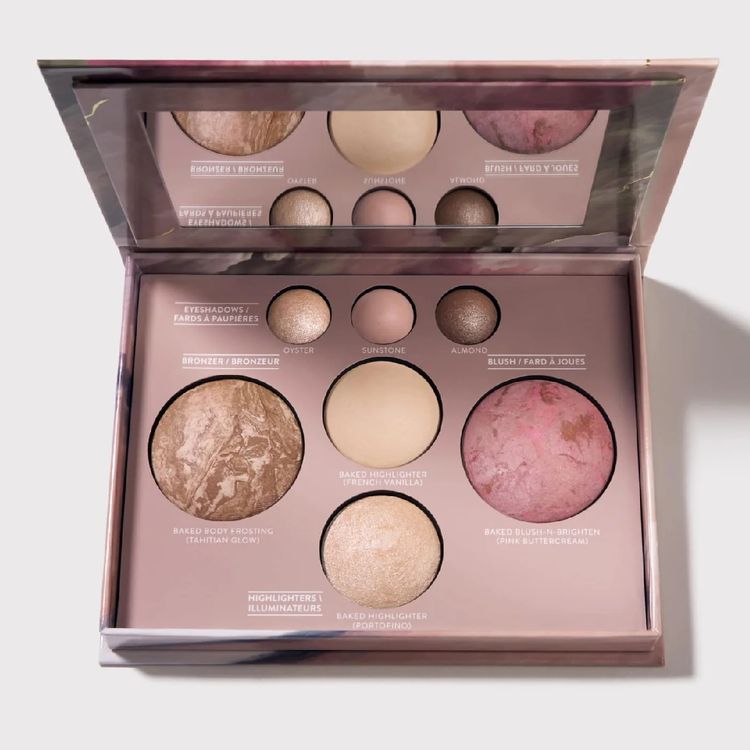 Laura Geller baked face palette with bronzer, blush, highlighter and eyeshadows in warm pink and bronze tones, shown open with mirror.