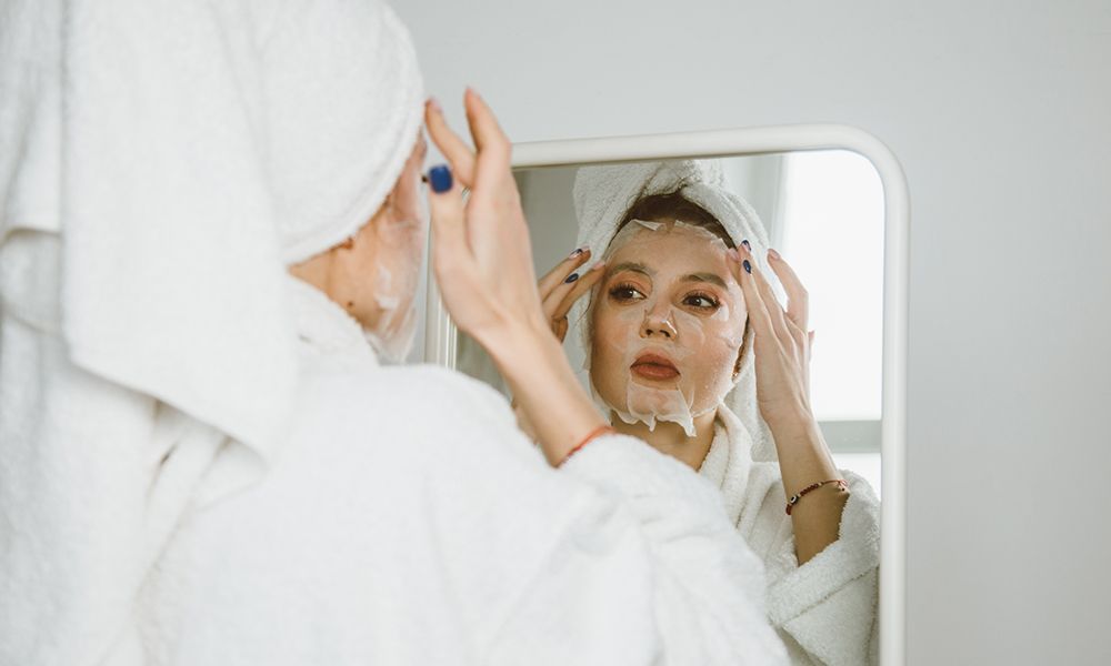 Young beautiful woman with a beauty face mask