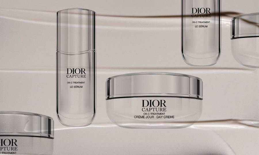 Dior Capture OX-C serum and day cream on a skin care smear background