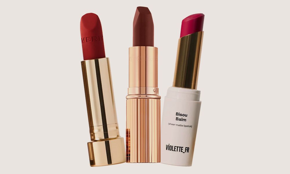 various lipsticks on beige background