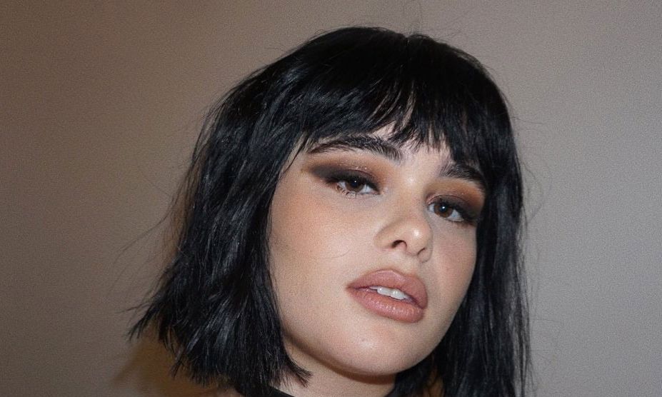 woman with short hair and blunt bangs