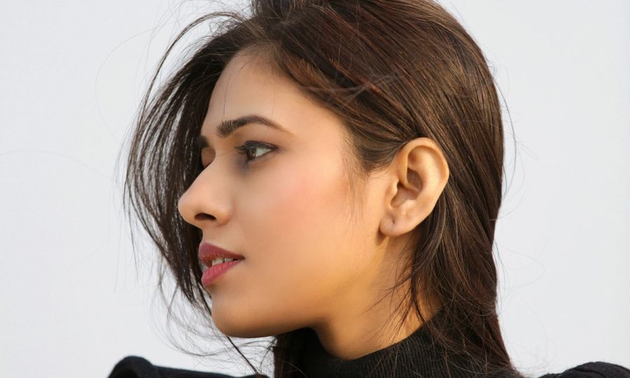 brown-haired woman looking to the side