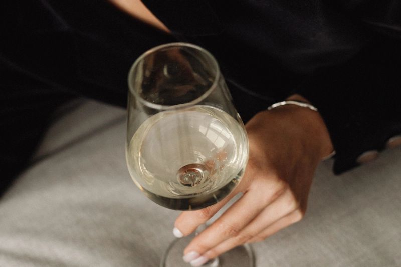 sophisticated wine tasting portraits modern asian woman in elegant black outfit holding white wine glass