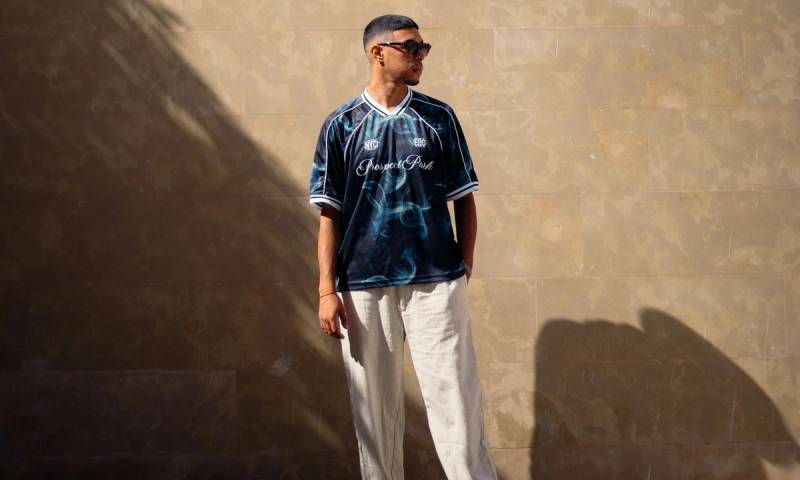 man in sunglasses standing in the sun