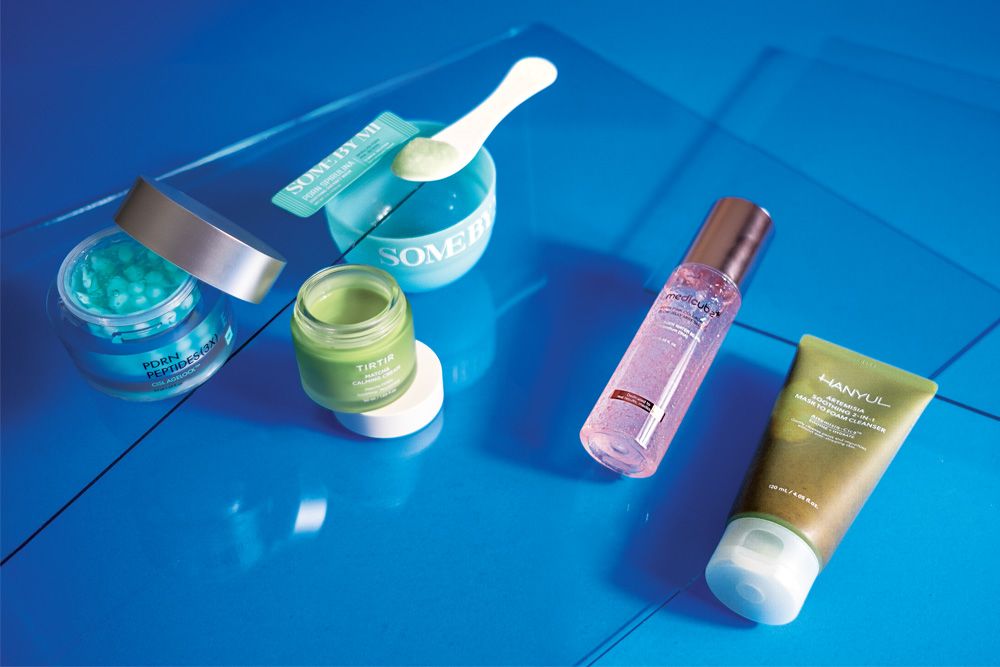 k-beauty products on blue background