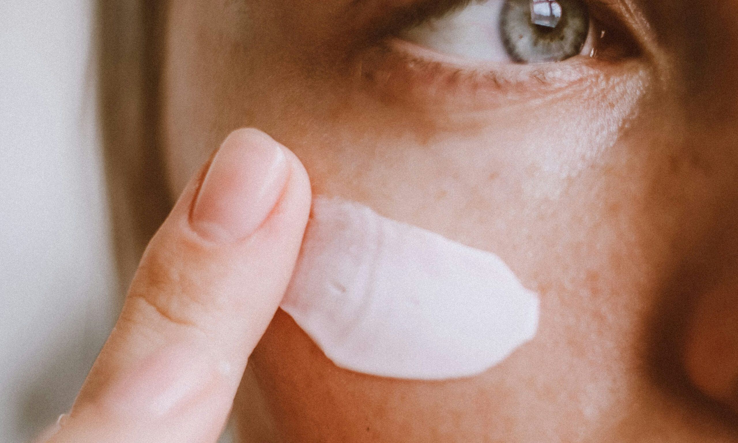 face cream up close on cheek