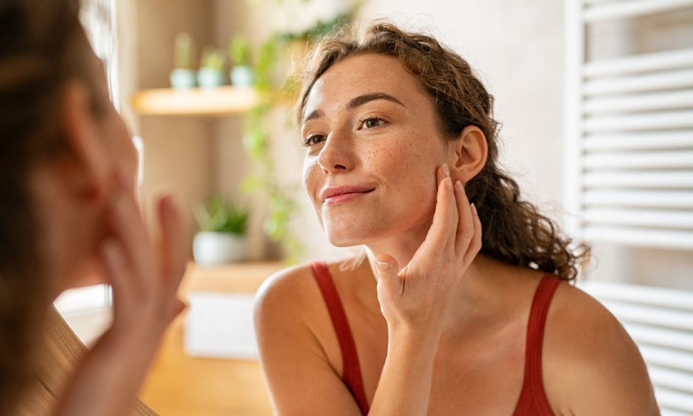 Woman touching her face