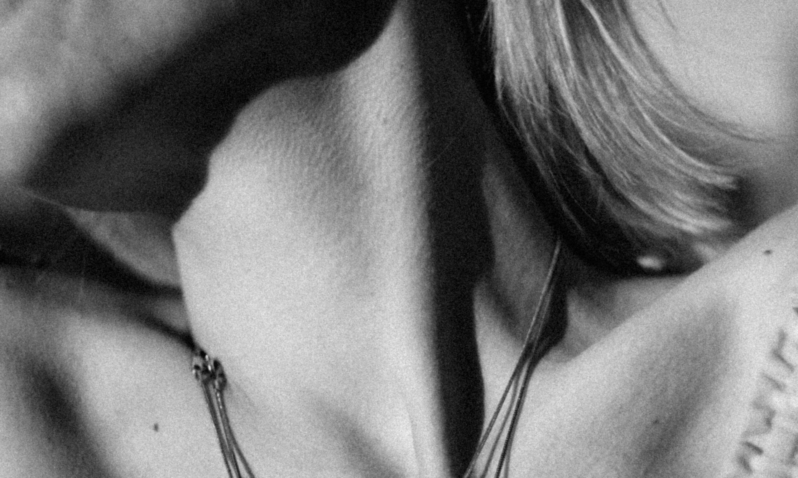 black and white photo of woman's neck