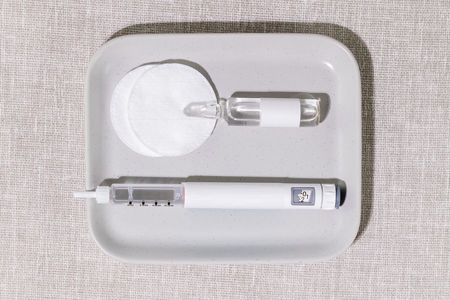 Medical Setup With Injection Pen, Glass Ampoule And Cotton Pads On Soft Fabric Background. Concept Of Home Beauty Treatments, Beauty Injection, Luxury Wellness Trends, And Skincare Innovation