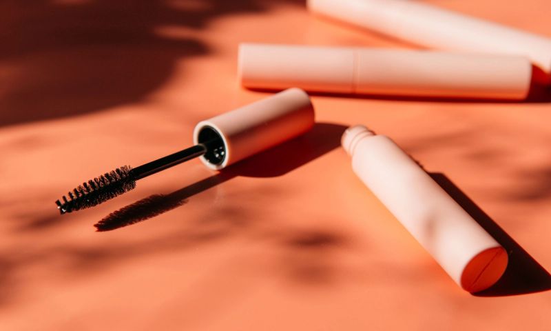 mascara on orange background