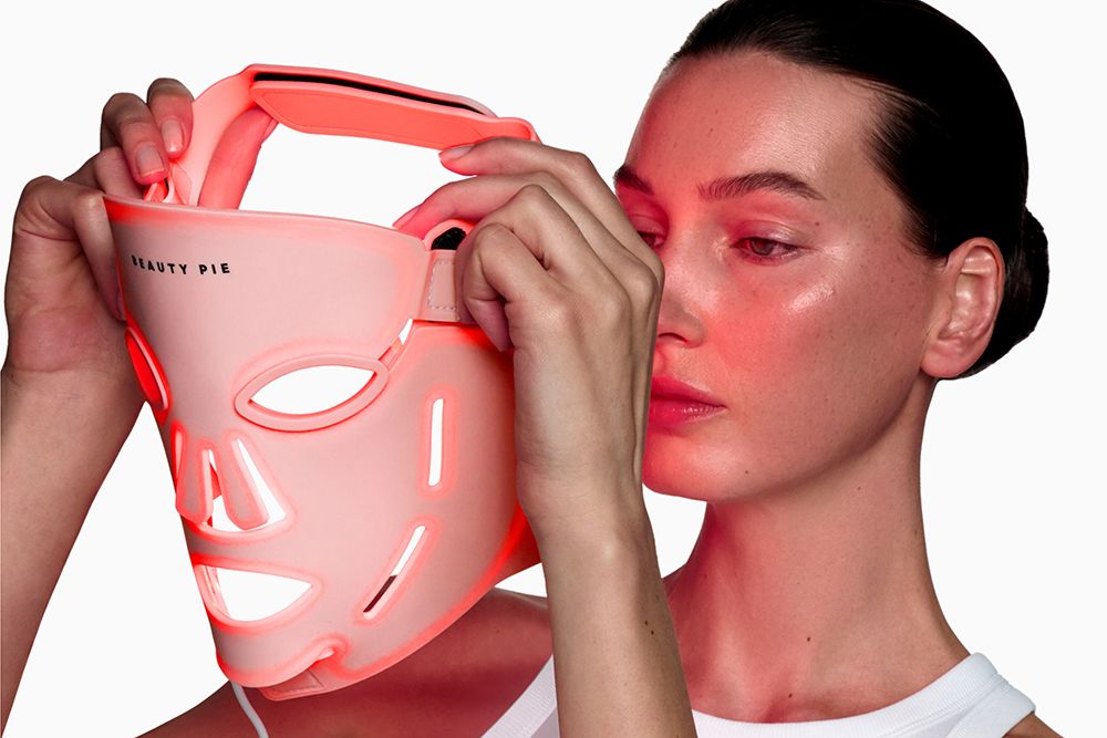 woman putting on beauty pie mask