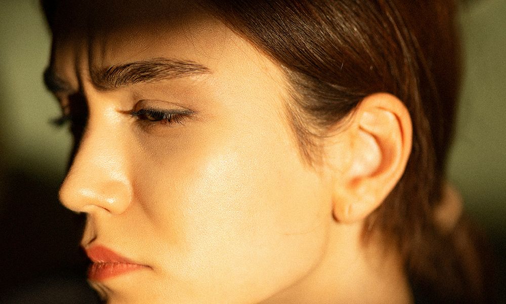 woman furrowing forehead