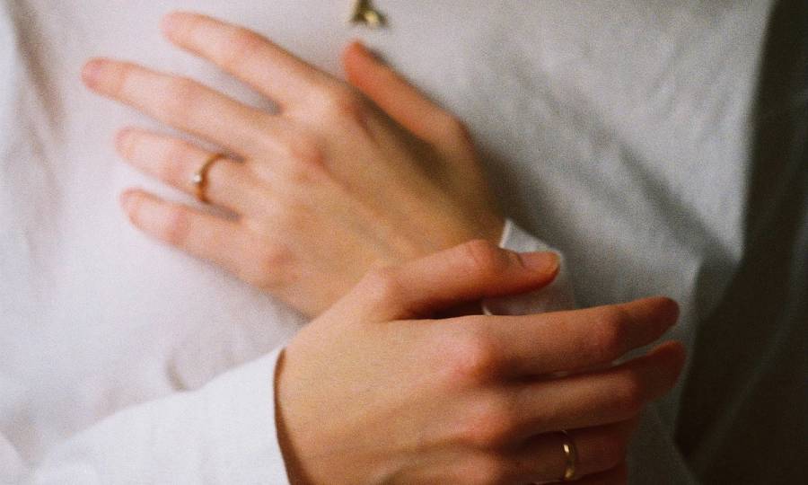 hands over chest